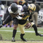
              Purdue safety Cam Allen (10) breaks up a pass to Northwestern wide receiver Malik Washington (6) during the second half of an NCAA college football game in West Lafayette, Ind., Saturday, Nov. 19, 2022. Purdue defeated Northwestern 17-9. (AP Photo/Michael Conroy)
            