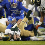 
              Colorado State quarterback Clay Millen, front, is sacked by Air Force defensive lineman Peyton Zdroik in the first half of an NCAA college football game Saturday, Nov. 19, 2022, at Air Force Academy, Colo. (AP Photo/David Zalubowski)
            