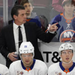 
              New York Islanders coach Lane Lambert gestures to the team during the second period of an NHL hockey game against the Chicago Blackhawks on Tuesday, Nov. 1, 2022, in Chicago. (AP Photo/David Banks)
            