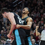 
              Portland Trail Blazers forward Drew Eubanks, left, and guard Josh Hart react after Eubanks scored a basket against the San Antonio Spurs during the second half of an NBA basketball game in Portland, Ore., Tuesday, Nov. 15, 2022. (AP Photo/Craig Mitchelldyer)
            