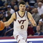 
              Virginia Tech's Hunter Cattoor (0) drives the ball up the court against Penn State in the second half of an NCAA college basketball game at the Charleston Classic in Charleston, S.C., Friday, Nov. 18, 2022. (AP Photo/Mic Smith)
            