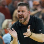 
              FILE - Texas coach Chris Beard talks to players during the first half of an NCAA college basketball game against Baylor, Monday, Feb. 28, 2022, in Austin, Texas. The Longhorns open the season ranked No. 12 and will play in a shiny new home arena with a lineup full of veteran experience boosted by key newcomers. (AP Photo/Eric Gay, File)
            