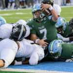 
              Tulane quarterback Michael Pratt (7) scores a touchdown in the first half during an NCAA college football game against UCF in New Orleans, Saturday, Nov. 12, 2022. (AP Photo/Matthew Hinton)
            