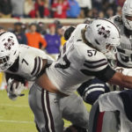 
              Mississippi State running back Jo'quavious Marks (7) follows the block of offensive lineman Cole Smith (57) for a 1-yard touchdown during the first half of the team's NCAA college football game against Mississippi in Oxford, Miss., Thursday, Nov. 24, 2022. (AP Photo/Rogelio V. Solis)
            