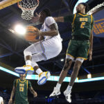 
              UCLA guard Dylan Andrews, left, shoots as Norfolk State guard Terrance Jones defends during the second half of an NCAA college basketball game Monday, Nov. 14, 2022, in Los Angeles. UCLA won 86-56. (AP Photo/Mark J. Terrill)
            
