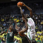
              Oregon center N'Faly Dante (1) scores over Florida A&M guard Jordan Chatman (2) as forward Chase Barrs (10) comes in on the play during the first half of an NCAA college basketball game Monday, Nov. 7, 2022, in Eugene, Ore. (AP Photo/Andy Nelson)
            