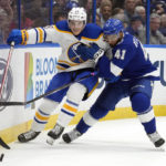 
              Buffalo Sabres center Peyton Krebs (19) and Tampa Bay Lightning left wing Pierre-Edouard Bellemare (41) battle for a loose puck during the second period of an NHL hockey game Saturday, Nov. 5, 2022, in Tampa, Fla. (AP Photo/Chris O'Meara)
            