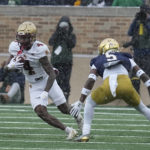 
              Boston College's Zay Flowers (4) runs against Notre Dame cornerback Cam Hart during the first half of an NCAA college football game, Saturday, Nov. 19, 2022, in South Bend, Ind. (AP Photo/Darron Cummings)
            