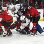 
              Canada goaltender Emerance Maschmeyer (38) looks for the puck as Canada's Blayre Turnbull (40) and Erin Ambrose (23) work against United States' Hilary Knight (21) and Kelly Pannek (12) during the first period of a Rivalry Series hockey game Tuesday, Nov. 15, 2022, in Kelowna, British Columbia. (Jesse Johnston/The Canadian Press via AP)
            