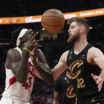 
              Toronto Raptors' Pascal Siakam (43) is fouled by Cleveland Cavaliers' Dean Wade during the first half of an NBA basketball game in Toronto, Monday, Nov. 28, 2022. (Chris Young/The Canadian Press via AP)
            