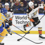 
              Anaheim Ducks' Austin Strand shoots the puck against the St. Louis Blues during the first period of an NHL hockey game, Monday, Nov. 21, 2022, in St. Louis. (AP Photo/Michael Thomas)
            