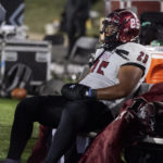 
              New Mexico State defensive lineman Lama Lavea sits on the bench in the final minutes of the team's NCAA college football game against Missouri on Saturday, Nov. 19, 2022, in Columbia, Mo. Missouri won 45-14. (AP Photo/L.G. Patterson)
            