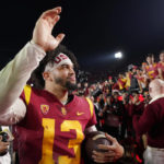 
              Southern California quarterback Caleb Williams waves to fans after USC defeated Notre Dame 38-27 an NCAA college football game Saturday, Nov. 26, 2022, in Los Angeles. (AP Photo/Mark J. Terrill)
            
