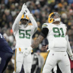 
              Green Bay Packers linebacker Preston Smith (91) and linebacker Kingsley Enagbare (55) celebrate after Smith sacked Tennessee Titans' Ryan Tannehill during the first half of an NFL football game Thursday, Nov. 17, 2022, in Green Bay, Wis. (AP Photo/Morry Gash)
            