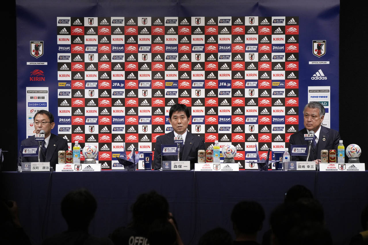Japan national team head coach Hajime Moriyasu, center, with Japan Football Association (JFA) Presi...