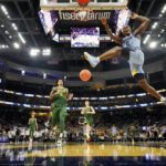 
              Marquette's Chase Ross dunks during the first half of an NCAA college basketball game against Baylor Tuesday, Nov. 29, 2022, in Milwaukee. (AP Photo/Morry Gash)
            