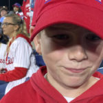 
              Ten-year-old Ty Kuhner, from Wilmington, Del., attends Game 3 of the baseball World Series between the Philadelphia Phillies and the Houston Astros on Tuesday, Nov. 1, 2022, in Philadelphia. Ty dropped a home run by Phillies' Brandon Marsh during the second inning. (AP Photo/Rob Maaddi)
            