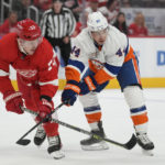 
              Detroit Red Wings left wing Adam Erne (73) and New York Islanders center Jean-Gabriel Pageau (44) battle for position in the first period of an NHL hockey game Saturday, Nov. 5, 2022, in Detroit. (AP Photo/Paul Sancya)
            