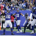 
              New York Giants running back Saquon Barkley (26) celebrates after scoring a touchdown against the Houston Texans during the fourth quarter of an NFL football game, Sunday, Nov. 13, 2022, in East Rutherford, N.J. (AP Photo/Seth Wenig)
            