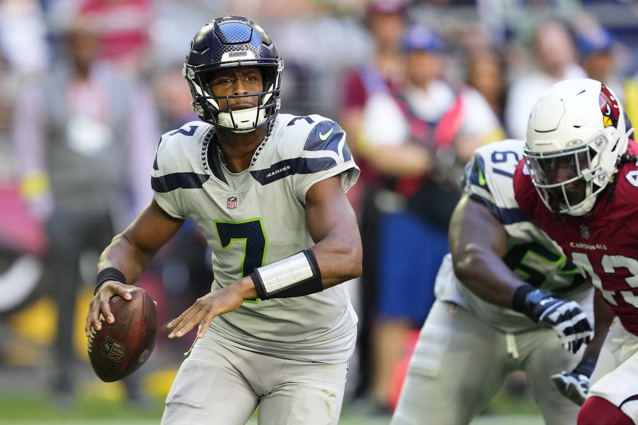 Seattle Seahawks quarterback Geno Smith (7) passes against the Arizona Cardinals during the first h...