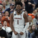 
              Virginia's Jayden Gardner (1) celebrates after a play against Illinois during the first half of an NCAA college basketball game Sunday, Nov. 20, 2022, in Las Vegas. (AP Photo/John Locher)
            