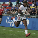 
              David Still of United States runs to score a try against Spain during the first day of the Hong Kong Sevens rugby tournament in Hong Kong, Friday, Nov. 4, 2022. The Hong Kong Sevens, a popular stop on the World Rugby Sevens Series circuit, is part of the government's drive to restore the city's image as a vibrant financial hub after it scrapped mandatory hotel quarantine for travelers. (AP Photo/Anthony Kwan)
            