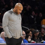 
              Los Angeles Lakers head coach Darvin Ham looks down at the ground in the closing seconds in the second half of an NBA basketball game against the Sacramento Kings Friday, Nov. 11, 2022, in Los Angeles. (AP Photo/Mark J. Terrill)
            