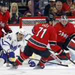 
              Carolina Hurricanes' Jesper Fast (71) takes the puck from in front of goaltender Frederik Andersen (31) with Toronto Maple Leafs' Auston Matthews (34) and Hurricanes' Brett Pesce (22) nearby during the second period of an NHL hockey game in Raleigh, N.C., Sunday, Nov. 6, 2022. (AP Photo/Karl B DeBlaker)
            
