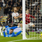
              Manchester United's Alejandro Garnacho, right, scores his side's second goal during the English Premier League soccer match between Fulham and Manchester United at the Craven Cottage stadium in London, Sunday, Nov. 13, 2022. (AP Photo/Leila Coker)
            