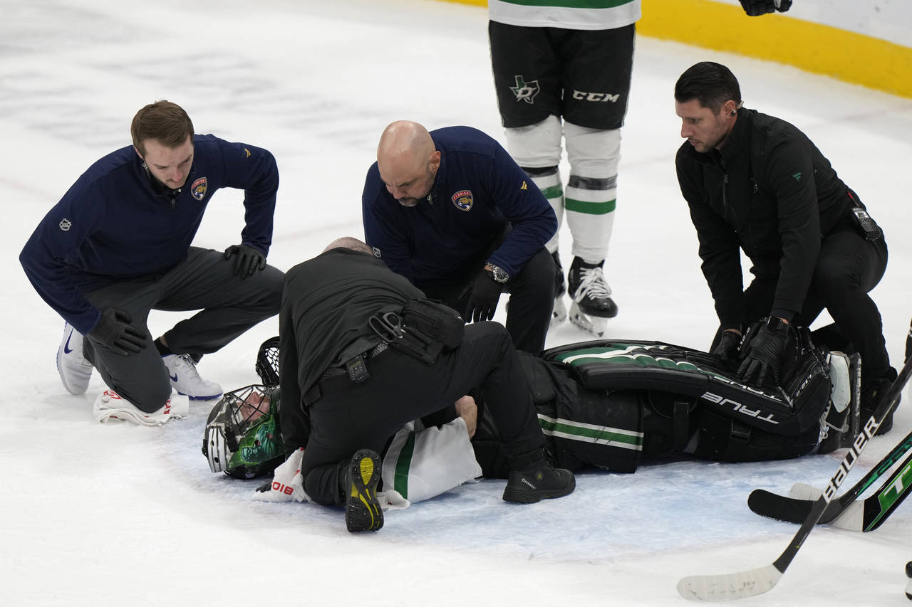 Dallas Stars goaltender Scott Wedgewood is attended to after a play during the second period of an ...