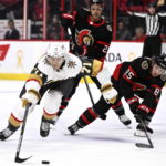 
              Vegas Golden Knights center William Karlsson (71) stretches out to regain control of the puck after getting away from Ottawa Senators defenseman Jake Sanderson (85) and right wing Mathieu Joseph (21) during the first period of an NHL hockey game in Ottawa, Ontario, Thursday, Nov. 3, 2022. (Justin Tang/The Canadian Press via AP)
            