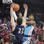 
              Gonzaga guard Malachi Smith, right, shoots while defended by North Florida guard Oscar Berry during the first half of an NCAA college basketball game, Monday, Nov. 7, 2022, in Spokane, Wash. (AP Photo/Young Kwak)
            