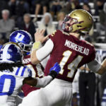 
              Boston College quarterback Emmett Morehead looks to throw under pressure during the first half of an NCAA college football game against Duke, Friday, Nov. 4, 2022, in Boston. (AP Photo/Mark Stockwell)
            