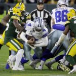 
              Dallas Cowboys quarterback Dak Prescott (4) runs the ball during the first half of an NFL football game against the Green Bay Packers Sunday, Nov. 13, 2022, in Green Bay, Wis. (AP Photo/Mike Roemer)
            