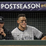 
              New York Yankees center fielder Aaron Judge watches play from the dugout during the second inning in Game 2 of baseball's American League Championship Series between the Houston Astros and the New York Yankees, Thursday, Oct. 20, 2022, in Houston. (AP Photo/Eric Gay)
            