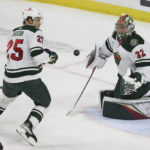 
              Minnesota Wild goaltender Filip Gustavsson (32) watches the puck after blocking a shot by the Carolina Hurricanes during the second period of an NHL hockey game Saturday, Nov. 19, 2022, in St. Paul, Minn. (AP Photo/Stacy Bengs)
            