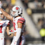 
              Utah safety Sione Vaki, right, gestures after making a stop as safety R.J. Hubert joins in the celebration in the first half of an NCAA college football game against Colorado, Saturday, Nov. 26, 2022, in Boulder, Colo. (AP Photo/David Zalubowski)
            