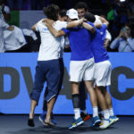 
              Team Italy celebrates after defeating USA in a Davis Cup quarter-final tennis match between Italy and USA in Malaga, Spain, Thursday, Nov. 24, 2022. (AP Photo/Joan Monfort)
            