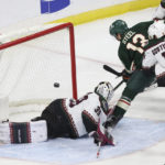 
              Minnesota Wild center Sam Steel (13) scores a goal against Arizona Coyotes goaltender Connor Ingram during the second period of an NHL hockey game, Sunday, Nov. 27, 2022, in St. Paul, Minn. (AP Photo/Stacy Bengs)
            