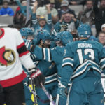 
              San Jose Sharks center Noah Gregor celebrates with teammates after scoring a goal against the Ottawa Senators during the first period of an NHL hockey game in San Jose, Calif., Monday, Nov. 21, 2022. (AP Photo/Godofredo A. Vásquez)
            