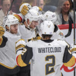 
              Vegas Golden Knights' Reilly Smith (19) celebrates with teammates after scoring against the Montreal Canadiens during the second period of an NHL hockey game Saturday, Nov. 5, 2022, in Montreal. (Graham Hughes/The Canadian Press via AP)
            