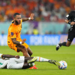 
              Senegal's Iliman Ndiaye, below, and Memphis Depay of the Netherlands battle for the ball during the World Cup, group A soccer match between Senegal and Netherlands at the Al Thumama Stadium in Doha, Qatar, Monday, Nov. 21, 2022. (AP Photo/Petr David Josek)
            