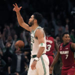 
              Boston Celtics forward Jayson Tatum (0) celebrates after hitting a 3-pointer during the second half of the team's NBA basketball game against the Miami Heat, Wednesday, Nov. 30, 2022, in Boston. (AP Photo/Charles Krupa)
            
