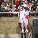 
              Oklahoma wide receivers Drake Stoops (12) and Marvin Mims Jr. (17) celebrate after Mims' touchdown against Texas Tech during the second quarter of an NCAA college football game in Lubbock, Texas, Saturday, Nov. 26, 2022. (Ian Maule/Tulsa World via AP)
            