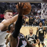 
              Denver Nuggets forward Vlatko Cancar, left, blocks the shot of Los Angeles Clippers guard John Wall during the second half of an NBA basketball game Friday, Nov. 25, 2022, in Los Angeles. (AP Photo/Mark J. Terrill)
            