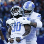 
              Detroit Lions running back Jamaal Williams (30) celebrates after scoring a touchdown during the first half of an NFL football game against the New York Giants, Sunday, Nov. 20, 2022, in East Rutherford, N.J. (AP Photo/John Munson)
            