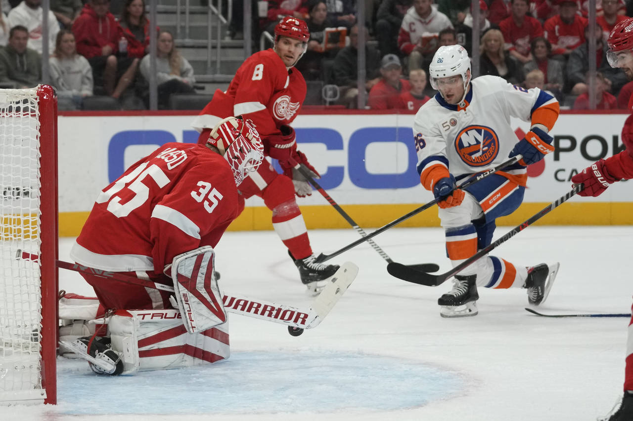 Detroit Red Wings goaltender Ville Husso (35) stops a New York Islanders right wing Oliver Wahlstro...