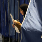 
              A woman leaves a voting booth after voting at a polling station in Copenhagen, Denmark, on Tuesday, Nov 1, 2022. (AP Photo/Sergei Grits)
            