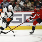 
              Philadelphia Flyers left wing Joel Farabee (86) skates with the puck against Washington Capitals defenseman Martin Fehervary (42) during the second period of an NHL hockey game, Wednesday, Nov. 23, 2022, in Washington. (AP Photo/Nick Wass)
            