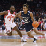 
              Charleston Southern's Claudell Harris, right, dribbles past Ohio State's Bruce Thornton during the first half of an NCAA college basketball game Thursday, Nov. 10, 2022, in Columbus, Ohio. (AP Photo/Jay LaPrete)
            